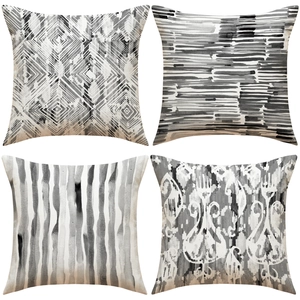 Set of four black and white geometric ethnic style linen throw pillow covers for home decor