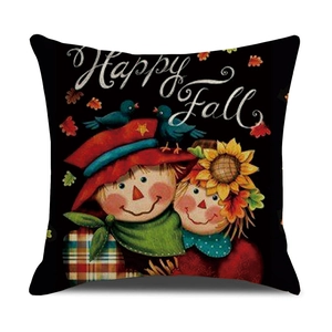 Detail of Happy Fall linen pillowcase with scarecrow, sunflower, and maple leaf prints