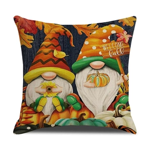 Close-up of linen pillow cover texture with gnomes, pumpkins and Welcome Fall text