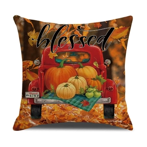 Detail of linen pillow cover with vintage red truck, pumpkins, and Blessed text print