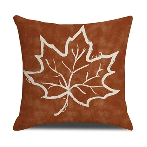 Detailed texture of autumn pumpkin maple leaf linen pillowcase in warm burnt orange tone