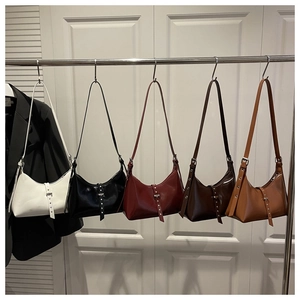 Selection of retro dumpling bags in five colors with polished leather and metal buckles
