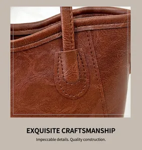 Close-up of vintage brown leather texture and reinforced stitching on a bucket bag