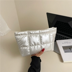 Minimalist white quilted square clutch bag with glossy finish and modern padded design