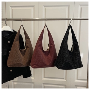 Detailed trio of leopard print hobo bags in brown, red and black soft faux suede