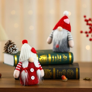 Pair of Valentine's Day gnomes with knitted hats and hearts on vintage books