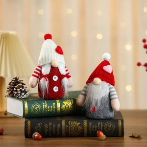 Handcrafted Valentine's Day plush gnomes with knitted heart hats on decorative books
