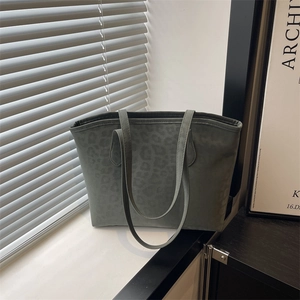 Large dark green leopard print tote bag in matte finish with long shoulder straps