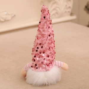 Detail of pink sequin gnome plush with white faux fur beard and striped arms for decoration