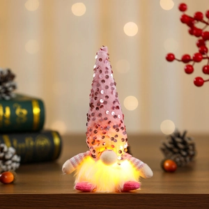 Detail of pink sequin gnome with warm glowing beard and festive holiday design