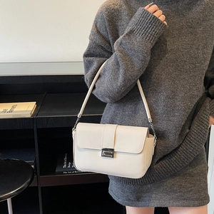 Chic off-white rectangular shoulder bag with silver buckle and leather strap