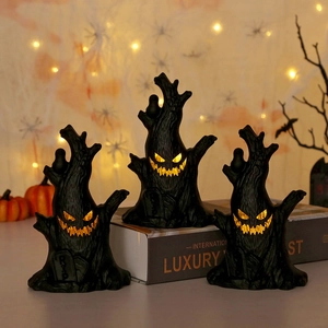 Three-piece Halloween tree stump set with glowing pumpkin faces and R.I.P. tombstone detail