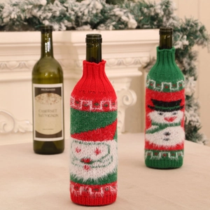 Christmas knitted wine bottle covers with Santa and Snowman motifs for festive table decor