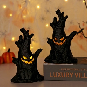 Halloween ghost tree stump ornaments with glowing LED evil faces and RIP gravestone bases