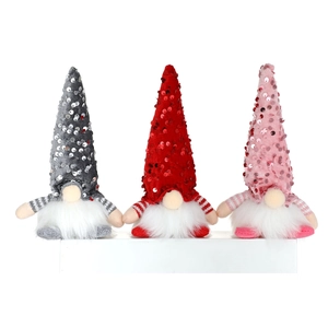 Three sequined Christmas gnomes in pink, red, and grey for festive home decoration