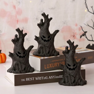 Detailed view of black resin Halloween ghost tree stump decor with RIP tombstone relief
