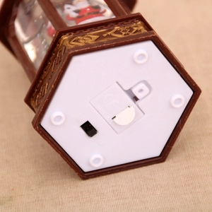Detail of hexagonal Christmas lantern base with power switch and battery compartment