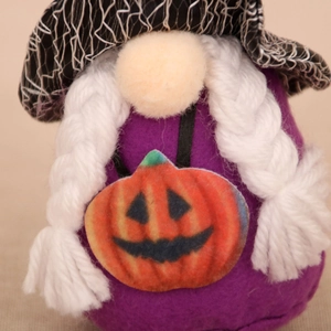 Detail of Halloween gnome plush with purple felt body, witch hat, and pumpkin applique