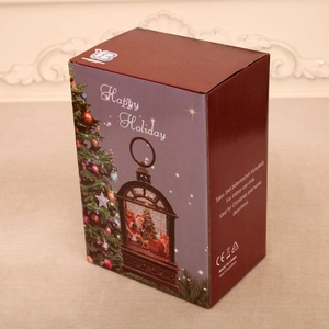 Detailed packaging showing Christmas music box lantern specifications and Happy Holiday design