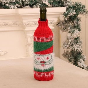 Detailed view of Santa Claus knitted wine bottle cover with soft plush and red green texture