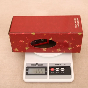 Christmas lantern gift box on scale showing weight 359g and size 84x84x216mm