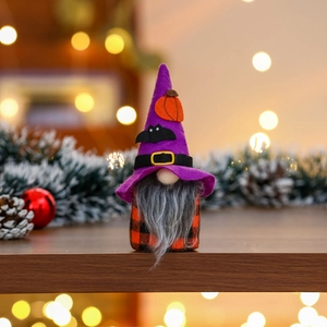 Detail of Halloween gnome with purple pumpkin hat and grey beard on festive background