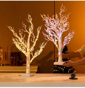 Detail of 65cm white birch-texture LED trees with warm and multicolor lights