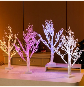Set of four 65cm white branch LED lighted trees in warm yellow, pink, blue and white glow