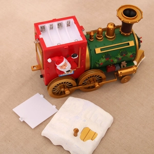 Detail showing internal battery compartment and gear of the Christmas train decoration