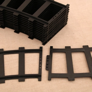 Detail showing stackable black 18650 battery spacer holders with interlocking design