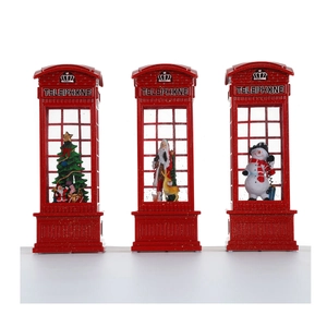 Three red Christmas telephone booths with Santa, snowman and tree in snowing scene