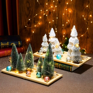Miniature lighted Christmas tree set with warm LED lights and wooden base for desk decor