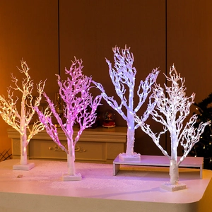 Four 65cm LED light-up Christmas trees with faux snow finish and stable square bases