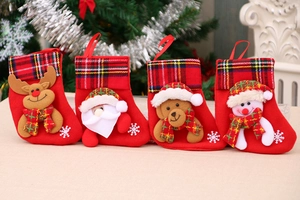 Set of 4 Christmas stockings featuring 3D Santa, reindeer, bear, and snowman hanging decors