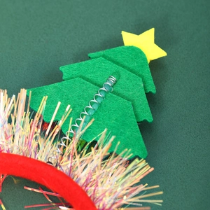 Detailed macro view of the metal spring connection on a festive Christmas tree headband