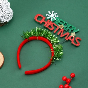 Red Merry Christmas headband with glitter letters and green tinsel for festive party decor