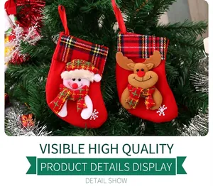 Detail showing plush Christmas stockings with snowman and reindeer plaid fabric appliques