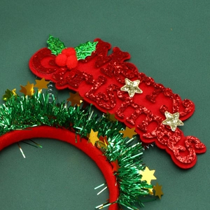 Detail of red Merry Christmas headband with glitter letters and gold star accent