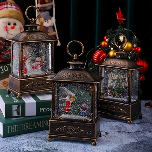 Vintage bronze Christmas lantern snow globe with Santa and snowman scene and LED light