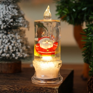 LED lighted Christmas candle ornament with Santa figure and swirling water glitter
