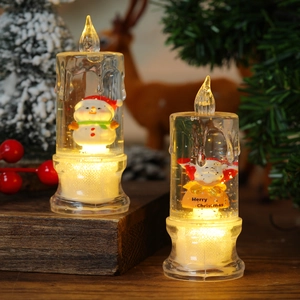 Christmas LED water candles with Santa and snowman figures on a wooden base