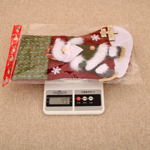 Detail of plush Christmas stocking with 3D Santa and Merry Christmas wood tag weighing 49g