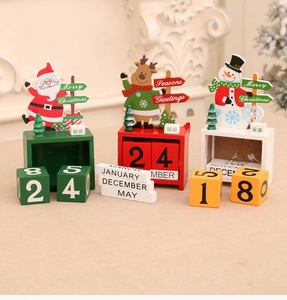Detailed view of hand-painted wooden Christmas advent calendar blocks in festive designs