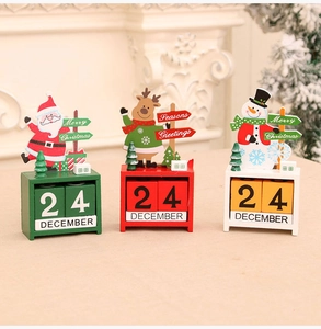 Detailed view of wooden Christmas countdown calendars with Santa, reindeer and snowman