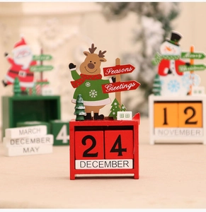 Close-up of wooden Christmas advent calendar with Santa, reindeer and snowman figures