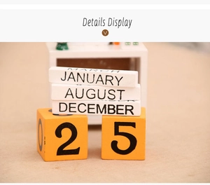 Close-up of wooden advent calendar blocks showing polished months and dates details