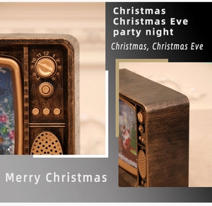 Detail of vintage Christmas TV decor showing control knobs and musical light buttons