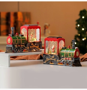 Detail of Christmas musical train snow globe with Santa and snowman in vintage style