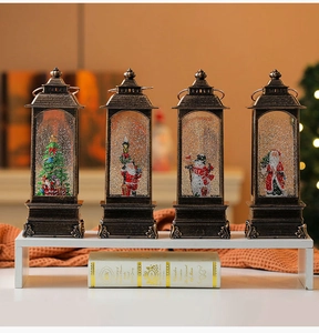 Set of four vintage bronze Christmas lanterns with warm light featuring Santa and snowman