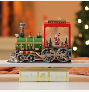 Macro shot of vintage Christmas train water globe featuring Santa Claus and glitter snow